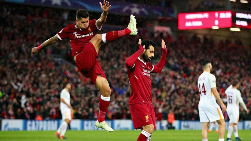 Roberto Firmino (l) and Mo Salah scored two goals apiece at Anfield