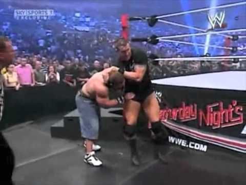 Randy Orton preparing to hit the RKO on John Cena