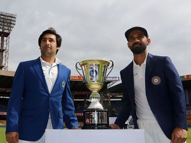Afghanistan skipper Asghar Stanikzai (Left) and Indian skipper Ajinkya Rahane (Right) before the one-off Test match