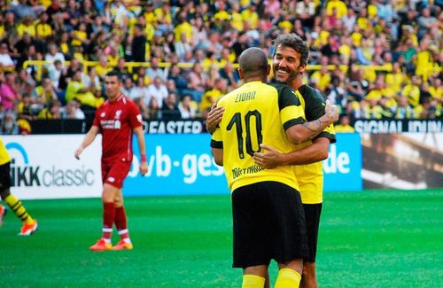 Egyptian star Mohamed Zidan and 1990 FIFA World Cup winner Karl-Heinz Riedle celebrating during the Borussia Dortmund vs Liverpool FC Legends Match at the BVB Season Opening on August 11, 2018. (Â© CPD Football / arunfoot)