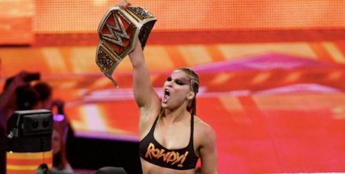 'Rowdy' Ronda Rousey celebrating after winning the RAW Women's Champioship