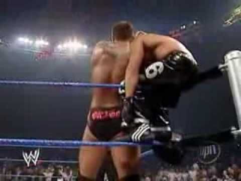 Orton placing Mysterio on the top rope 