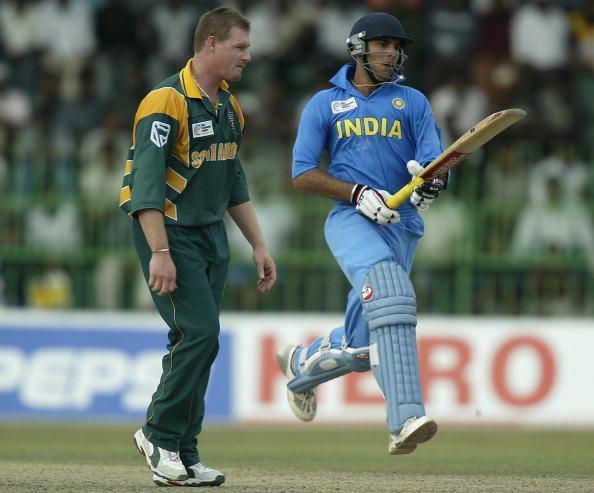 Youvraj Singh of India in action watched by Lance Kluesner of South Africa