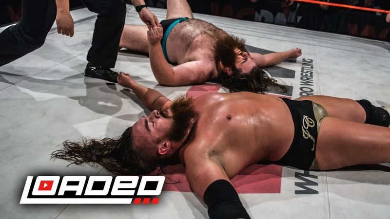 Joe Coffey performing against another WWE talent Killain Dane