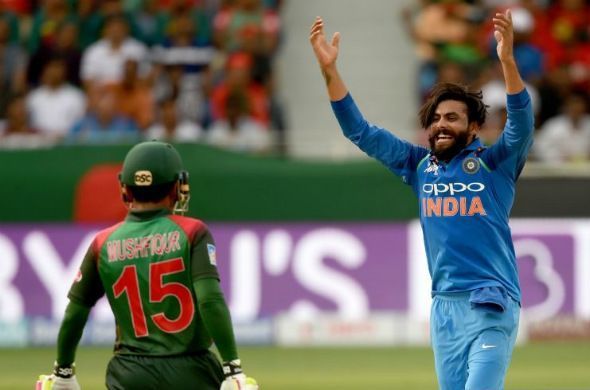 Ravindra Jadeja is celebrating after taking Mushfiqur's wicket