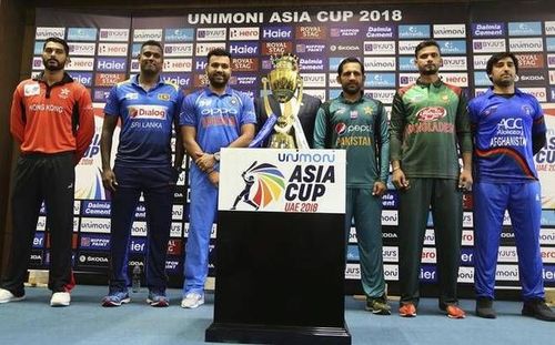 The captains with the Asia Cup