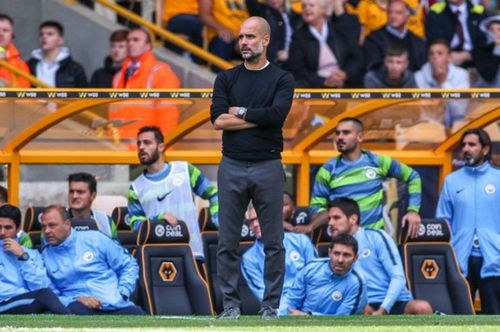 Pep Guardiola looking on at Molineux