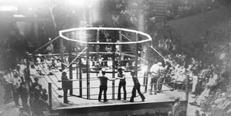 The first wrestling steel cage, made of chicken wire.