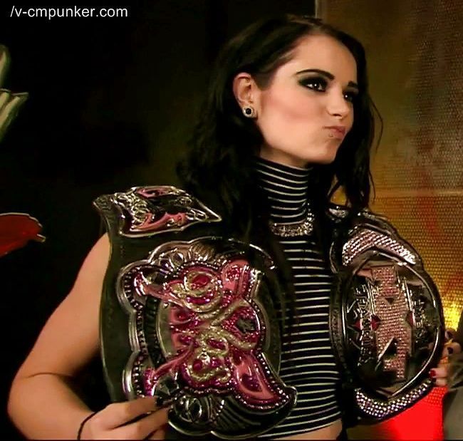 Paige as the WWE Divas and NXT Women's Champion 