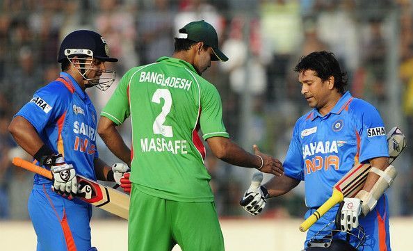 Mashrafe Mortaza is congratulating Sachin Tendulkar after his 100th international ton in Mirpur