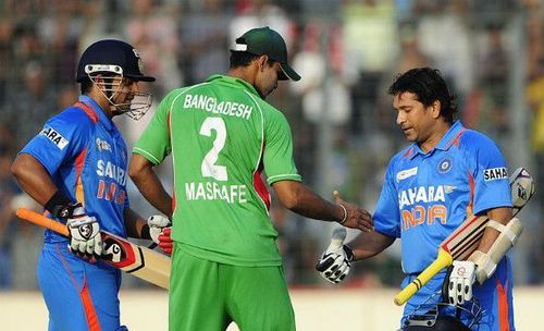 Mashrafe Mortaza is congratulating Sachin Tendulkar after his 100th international ton in Mirpur