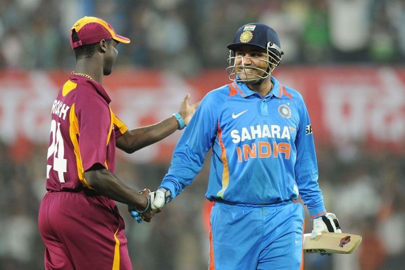 Kemar Roach congratulating Virender Sehwag for his epical 219 runs knock