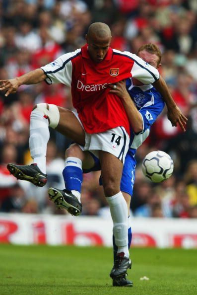 Thierry Henry of Arsenal and Steve Watson of Everton