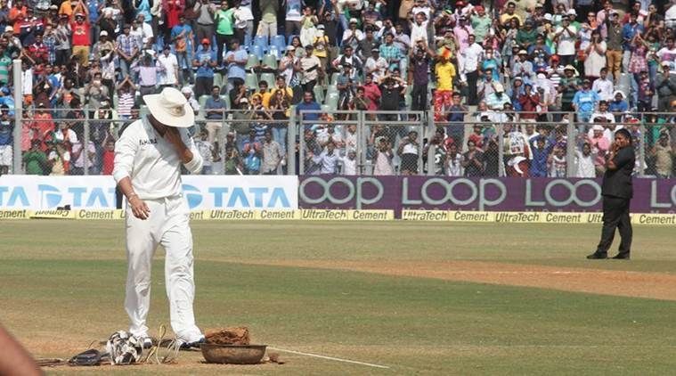 An emotional moment as Tendulkar kisses the pitch after his farewell match