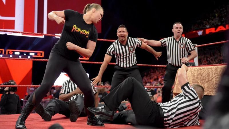 Watching a WWE referee having to stop the match would be a cool way to end things.