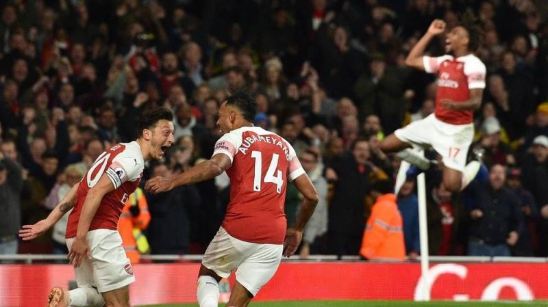 Mesut Ozil celebrates with Aubameyang scoring a potential goal of the season