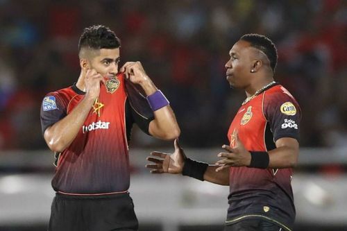 Ali Khan (left) with Dwayne Bravo