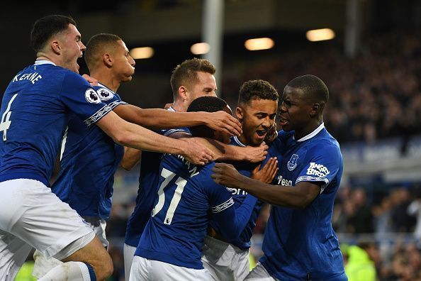 Calvert-Lewin is mobbed after scoring a crucial goal during their last-gasp 2-0 win over Palace