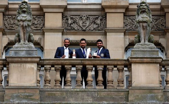 Dhoni with Shikar Dhawan (left) and Ravindra Jadeja (right), India&#039;s two biggest match-winners in the Champions Trophy 2013