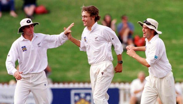 New Zealand's Daniel Vettori is congratulated by h