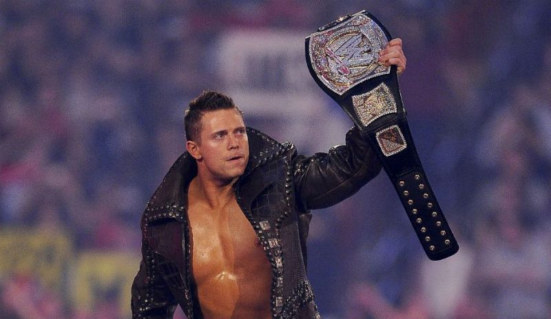 The Miz poses with the WWE championship.