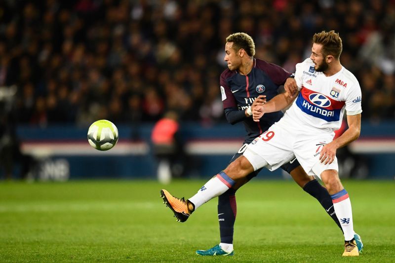 Tousart (right) in action against PSG, where he was sent off before the half-time whistle for two bookings