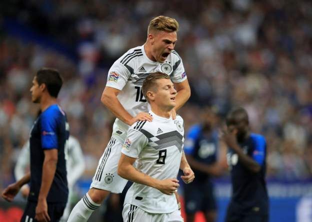 Kroos celebrates with Kimmich after scoring from the spot