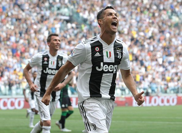 Ronaldo celebrates one of his two goals against Sassuolo for his new employers in Italy