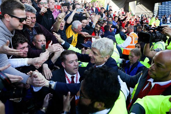 Wenger during his final match in charge of Arsenal - a 22-year reign - against Huddersfield last season