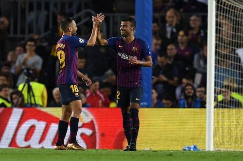 Rafinha celebrates the opening goal with Jordi Alba