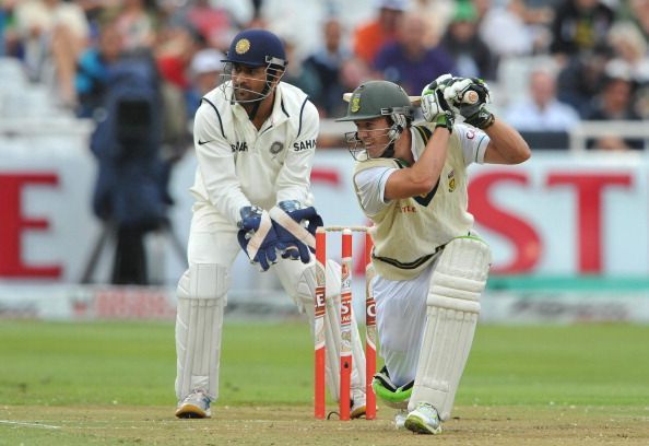 Mahendra Singh Dhoni (behind) and AB de Villiers (front).