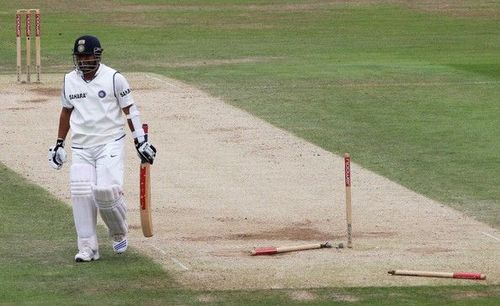 Sachin Tendulkar walks back after his stumps are left dismantled 