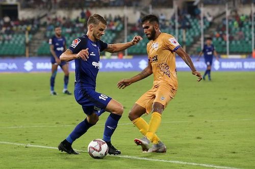 Andrea Orlandi of Chennaiyin FC is challenged by Subhasish Bose of Mumbai City FC [Image: ISL]