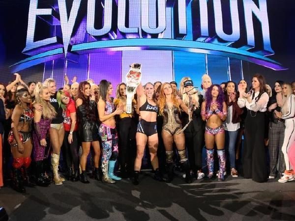 The women of RAW and SmackDown Live celebrate at the conclusion of WWE Evolution.