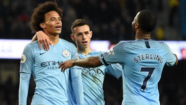 Leroy Sane celebrates his goal with Sterling and Laporte
