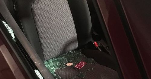 The rental car's window was smashed, though it is currently unknown whether anything was taken.