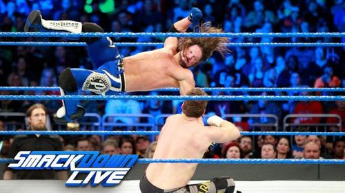 The Phenomenal AJ Styles delivers and equally phenomenal flying forearm smash to Sammi Zayn.