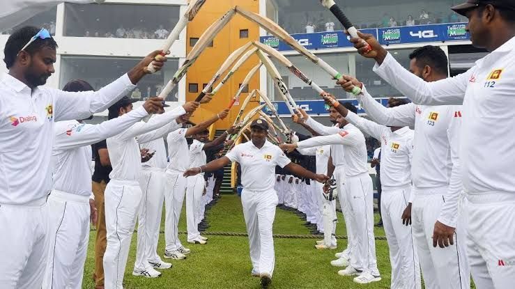 Sri Lankan players honour Rangana Herath during his final outing.