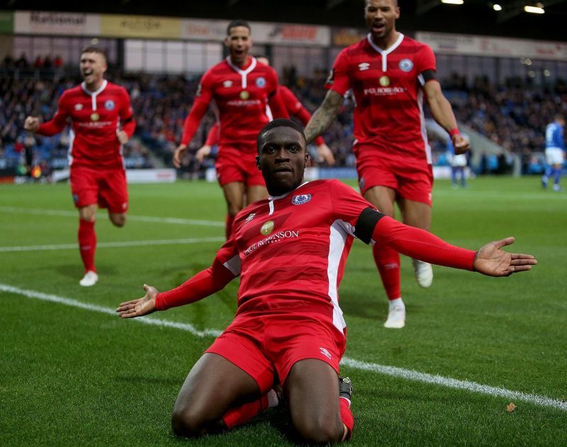 Moses celebrating his thunderous equaliser with Billericay teammates. (Picture source: NickyHayesPhoto)