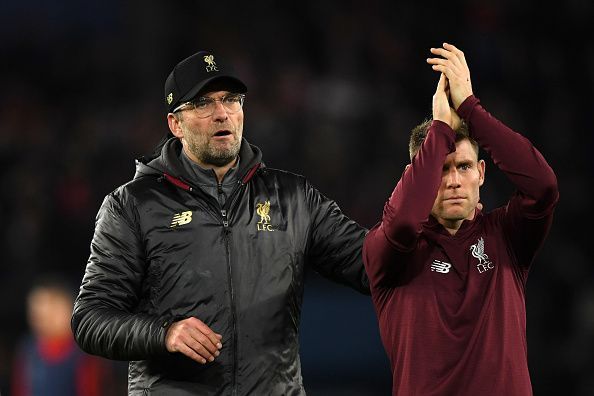 Milner and Klopp applaud the travelling Reds at full-time
