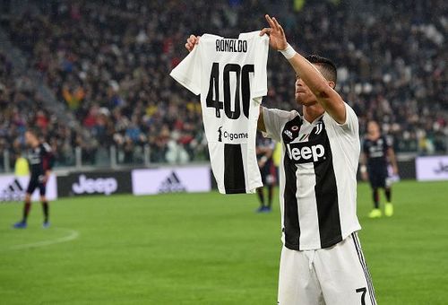 Ronaldo with his celebratory shirt after becoming the first player to score 400 goals in Europe's top five leagues