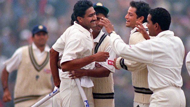 Kumble celebrating with his teammates after picking up the wicket