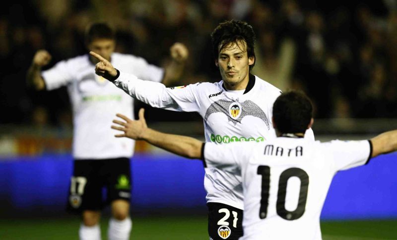 David Silva celebrates his goal for Valencia with Juan Mata January 17, 2010