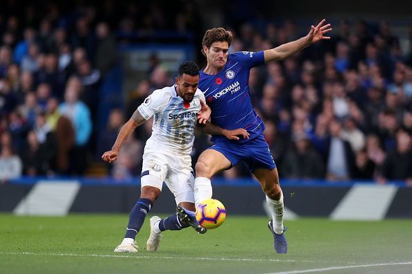 Alonso tussling with Walcott for possession during a busy afternoon&#039;s work