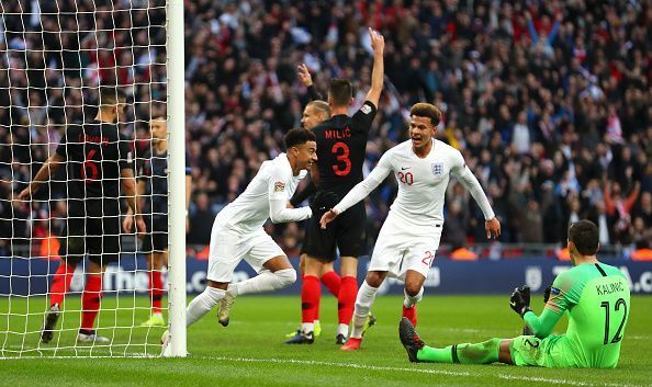 Lingard wheels away to celebrate a timely equaliser for England