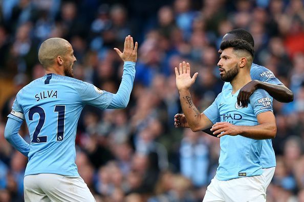 Manchester City players celebrating Aguero&#039;s goal.