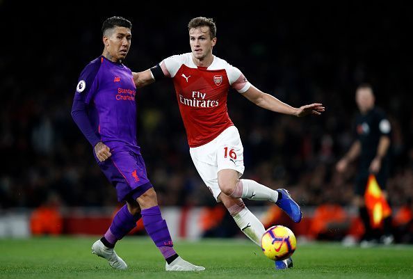 Rob Holding(R) will keep his place alongside Shkodran Mustafi