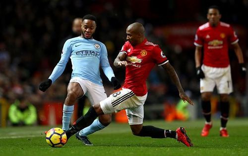 Sterling and Young battling it out last season at Old Trafford