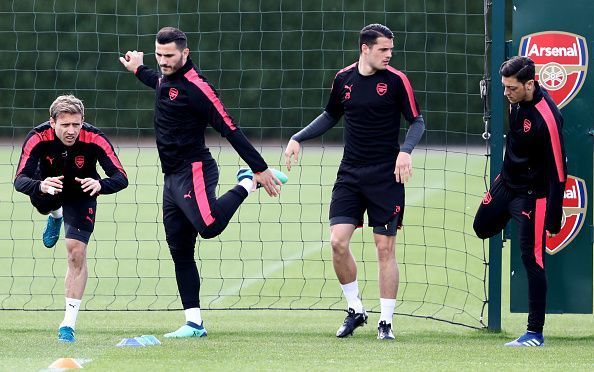 Monreal , Kolasinac, Xhaka, and Ozil taking part in a training drill