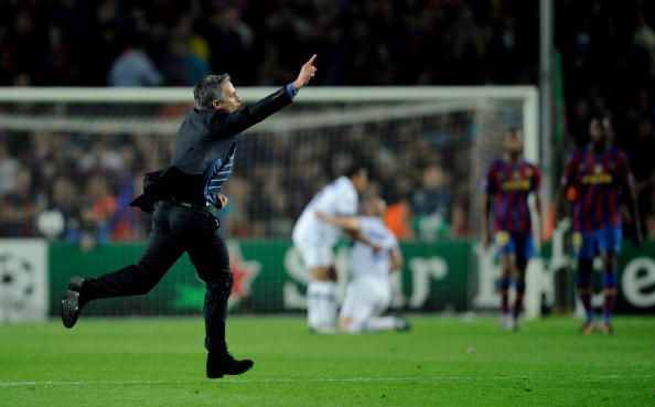 Mourinho runs on the pitch, after the